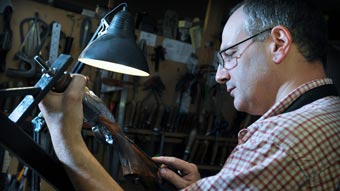 Jason Harris working as a gunsmith